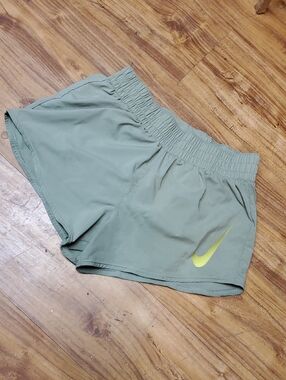 Nike Women's Sage Green Running Shorts with Yellow Swoosh
